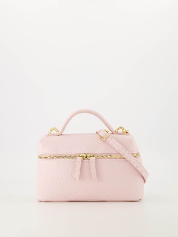 Hoogwaardig echt leren roze handtas gemaakt van grain leer die ook gedragen kan worden als crossbody tas. Bij de tas zit een afneembaar en verstelbaar hengsel.